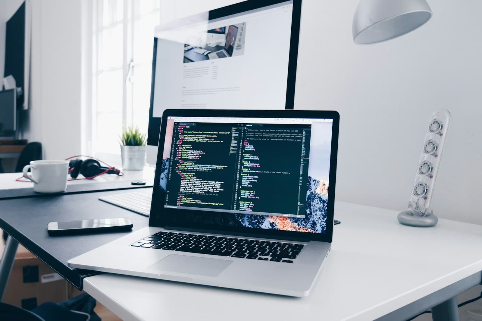 Developer workstation with code on screen